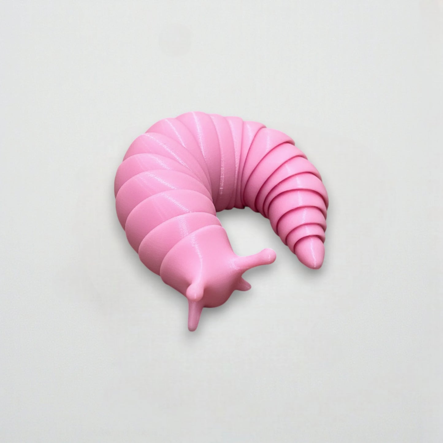 Figurine limace articulée rose imprimée en 3D, jouet flexible pour enfants et collectionneurs – Roze 3D-geprinte beweegbare slak speelgoed.